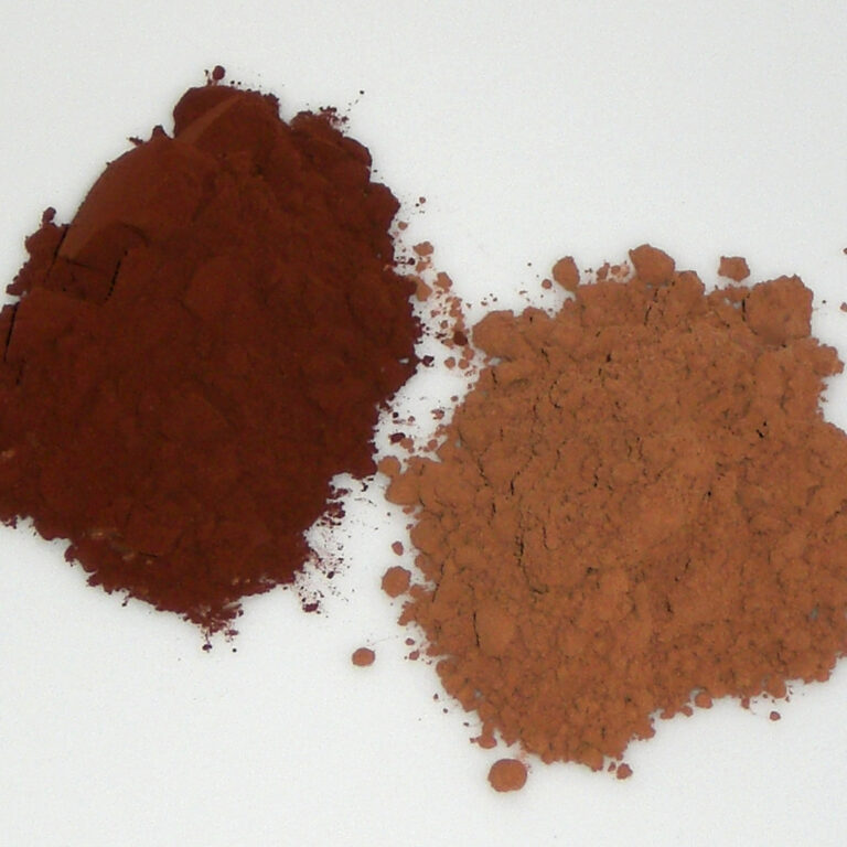 Two piles of cocoa powder: darker Dutch-process (alkalised) cocoa beside lighter natural cocoa