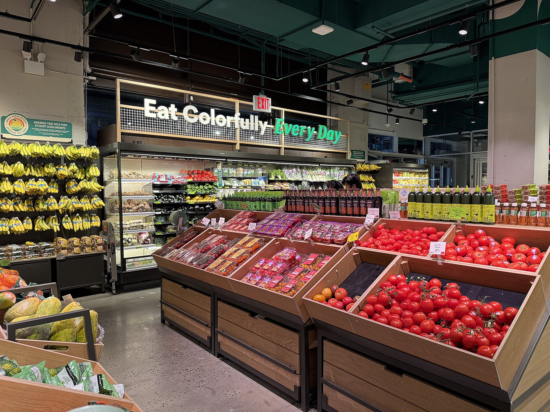 Produce section with fruit and vegetable displays inside a Whole Foods Market Daily Shop in New York