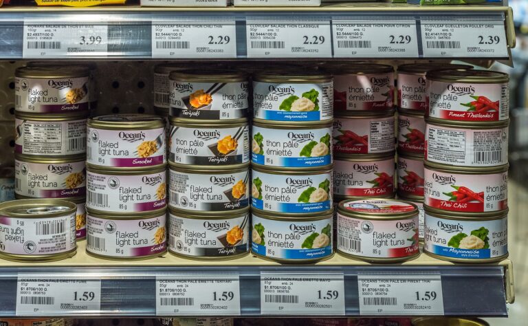 Shelf of canned tuna in a grocery store, one of the standardized foods covered by FDA's salt substitute rule