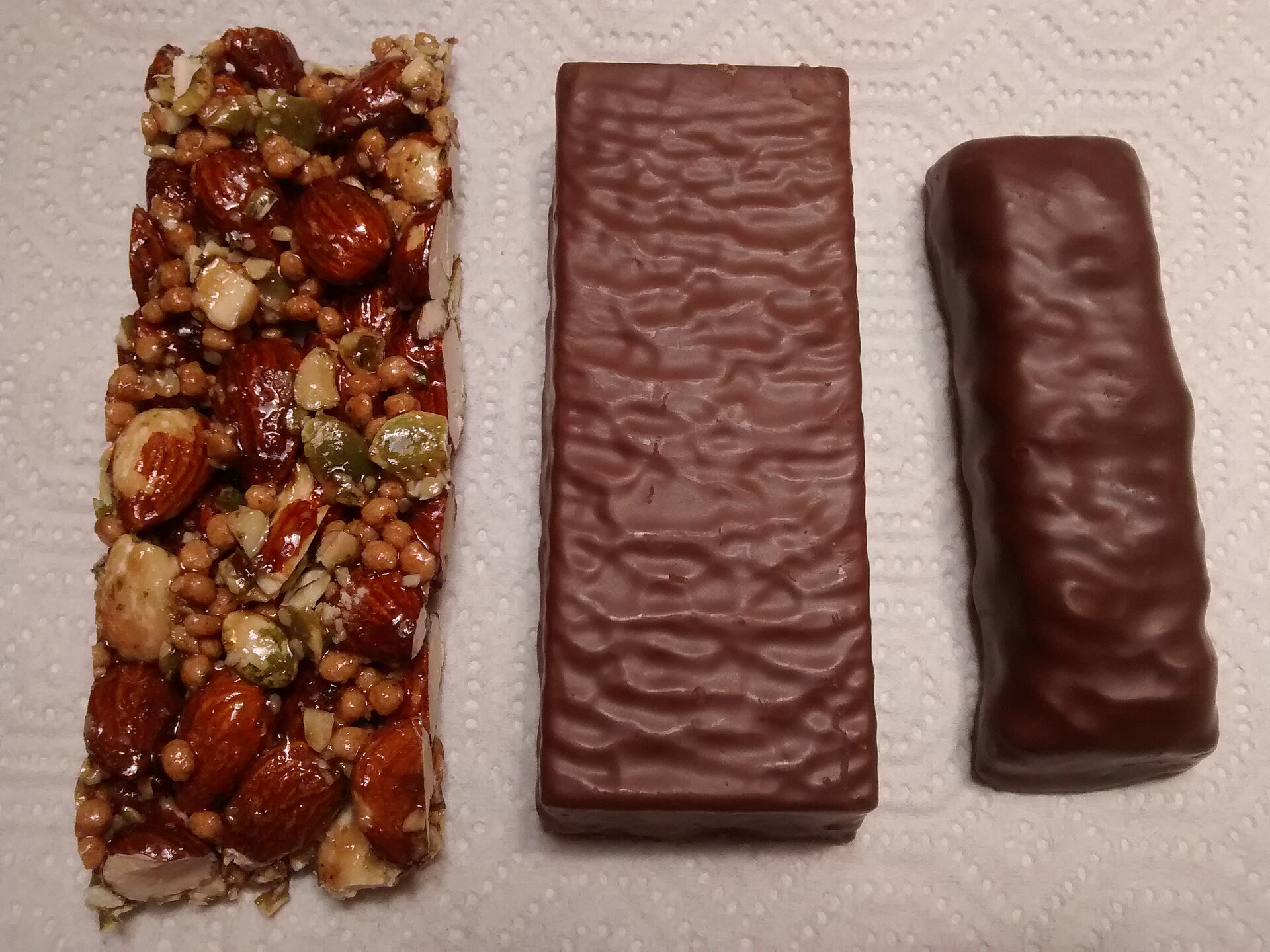 Three high-protein nutrition bars, representing the nutritional snacking category