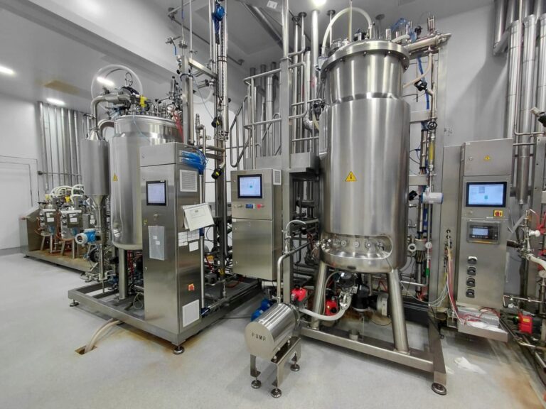 Stainless-steel industrial bioreactor and filtration system in a biomanufacturing plant