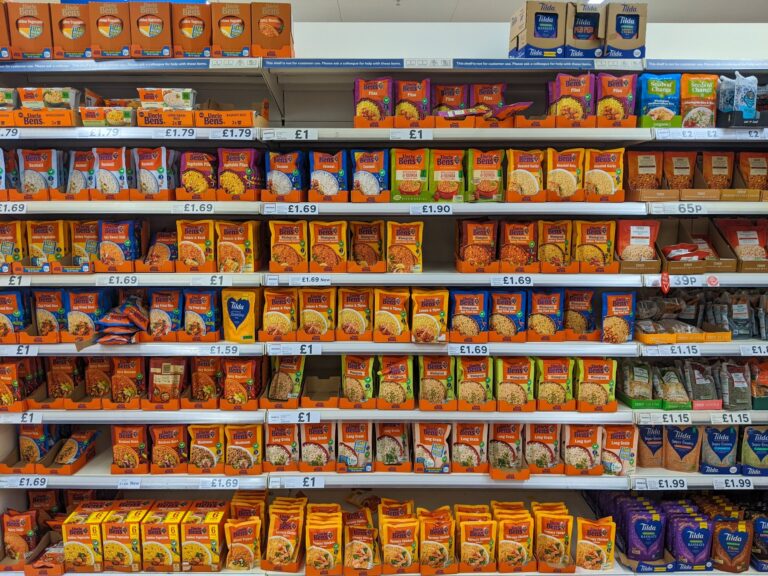 Packaged rice and grain products on supermarket shelves