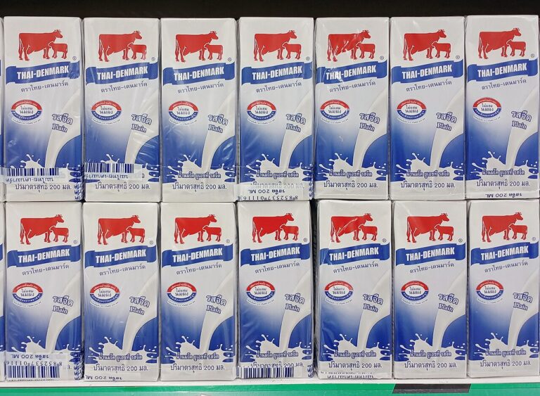 Cartons of UHT milk on display on a supermarket shelf